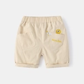 Kids beige cotton shorts with lion embroidery and elastic waist in flat lay view - 130cm / Beige
