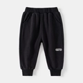 Schwarze Jungen Jogginghose aus Waffelstrick mit Gummizug und Psycha Monkey Aufnäher - Schwarz / 90cm