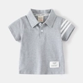 Detail of grey cotton polo shirt showing striped cuff and buttoned collar texture - 90cm / Gray