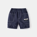 Boys navy blue casual shorts with elastic waistband and large pockets featuring white stitching - Navy Blue / 90cm