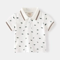 Kids white short sleeve polo shirt with green dinosaur and palm tree patterns - 90cm / White