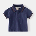 Kids navy polo shirt with green dinosaur prints and brown striped collar detailing - 90cm / Navy Blue