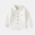 Flat lay of a white long-sleeved kids' shirt with dual chest pockets and wooden buttons - 90cm / White