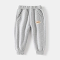 Pantaloni joggers in maglia per bambini grigio chiaro con ricamo 1977 e polsini a coste - 100cm / Grigio chiaro