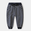 Detail of boys navy striped sweatpants featuring drawstring waist and smile badge - 90cm / Navy Wide Stripes