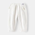 Minimalist beige cotton trousers for boys featuring an elastic waist and fashion label - White / 90cm