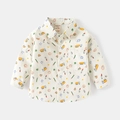 Close-up of boys cartoon shirt with rainbow print and functional chest pocket detail - 90cm / Cream Rainbow Sun