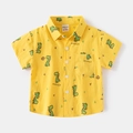 Short sleeve yellow kids shirt featuring colorful cartoon dinosaur prints and turn-down collar - Yellow / 120cm