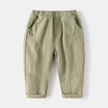 Detailed view of kids casual pants with elastic waist and curved decorative stitching - 90 / Light Green