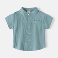 Detail of blue cotton linen kids short sleeve shirt with V-neck and wooden buttons - 90cm / Sea Green