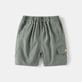 Flat lay of boy's sage green cotton cargo shorts with elastic waist and buttoned pocket - 90cm / Army Green