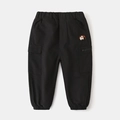 Kids black cargo pants with elephant embroidery and elastic waist shown on flat lay - Black / 90cm