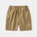 Detail of khaki cotton cargo shorts for boys with elastic waist and side letter pockets - 90cm / Khaki