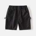 Detail of boys cargo shorts featuring elastic waistband and functional drawstring pockets - Black / 90cm