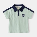 Kinder polo shirt in lichtgroen met marineblauwe details en een schattige beer - 90cm / Zeegroen