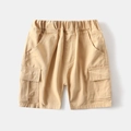Detailed view of kids cargo shorts showing elastic waistband and utility pockets - Khaki / 90cm