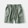 Detail of army green boys cargo shorts showing elastic waist and durable side flap pocket - Light Green / 110cm