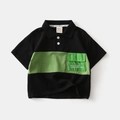 Kinder polo shirt in zwart en groen met borstzak en contrasterend kleurblokken ontwerp - 120cm / Zwart en Groen