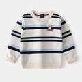 Détail d'un pull rayé pour enfant avec broderie ours et texture en maille douce - Rayé Abricot / 100cm