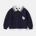 Detail van kinderpolo met wafeltextuur en witte gelaagde zoom voor een trendy look - Marineblauw / 90cm