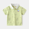 Close-up of kids light green polo shirt with dinosaur prints and high-quality embroidery - 90cm / Green