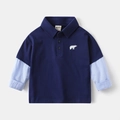 Detail of navy blue kids polo shirt featuring a polar bear embroidery and striped sleeves - 90cm / Navy Blue