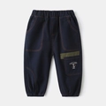 Close-up of boys cargo pants featuring contrast stitching and a cartoon cat embroidery detail - Navy Blue / 90cm