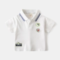 Detailed view of white cotton polo shirt collar with blue stripes and cute fruit patches - 90cm / White