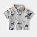 Dettaglio polo grigia per bambini con stampe dinosauri e colletto a righe arancioni - 90cm / Grigio