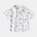 Witte katoenen jongensshirt met korte mouwen, kleurrijke dinosaurusprint en borstzak - Cartoon Dinosauriër Afdruk / Wit / 100cm