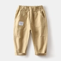 Detailed close-up of boys khaki cotton cargo pants with elastic waist and large pockets - Khaki / 90cm