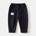 Detail of navy blue kids' cotton trousers with elastic waist and stylish woven patch - Navy Blue / 90cm