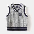 Macro detail of kids knit vest showing textured cable knit fabric and embroidered chest badge - 90cm / Gray