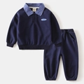 Detail of boys' navy blue tracksuit featuring plaid polo collar and GAME CHANGER patch - 90cm / Navy Blue