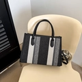 Striped tote bag in black, white, and grey textured knit with black leather handles - Black