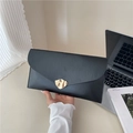 Minimalist black envelope clutch bag featuring a gold wavy buckle for daily commuting - Black