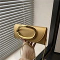 Champagne gold evening clutch bag with modern metallic oval handle and chain strap - Gold