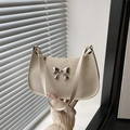 Creamy white hobo bag in pebbled leather with a silver metal butterfly accent - White