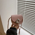 Pink heart saddle bag for girls with lychee grain leather and silver metal buckle - Pink