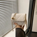 White quilted crossbody bag with gold chain strap and adjustable metal ball detail - White