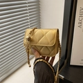 Quilted gold chain mini bag with adjustable metal ball strap for crossbody wear - Gold