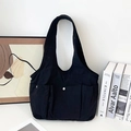 Grande borsa tote in tela nera con tasche multiple e chiusura con bottone argento - Nero