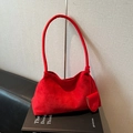 Chic red suede small shoulder bag with a unique semi-circle charm on the handle - Red