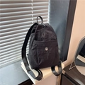 Fashionable black nylon mini backpack with pleated texture and silver metallic M logo - Black