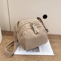 Minimalist beige corduroy shell crossbody bag with dual zipper and woven pullers - Khaki