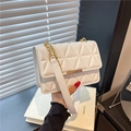 Chic white quilted crossbody bag with gold chain strap and geometric pattern - White