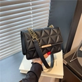 Chic black crossbody bag with triangle quilted stitching and gold chain strap - Black