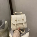 Mini cream white fashion backpack featuring textured woven flap and smooth leather panel - White