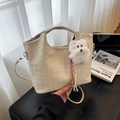 Beige woven leather bucket bag with top handle and plush puppy charm for women - With Pendant / Off White