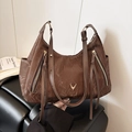 Dark brown textured tote bag with golden stag logo and decorative fringe zippers - Brown